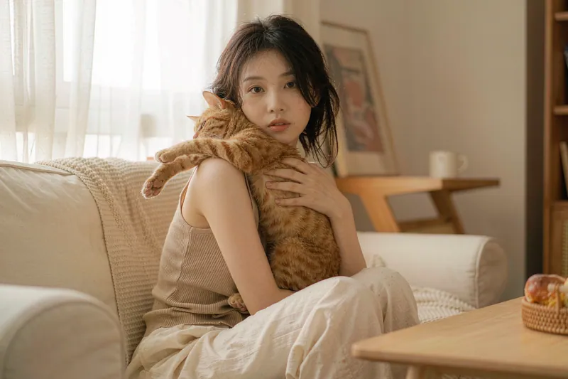 Cozy Home style — AI-generated sample of a woman with her ginger cat