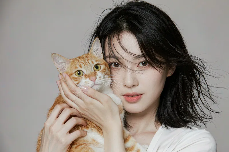 Studio Portrait style — AI-generated sample of a woman with her ginger cat